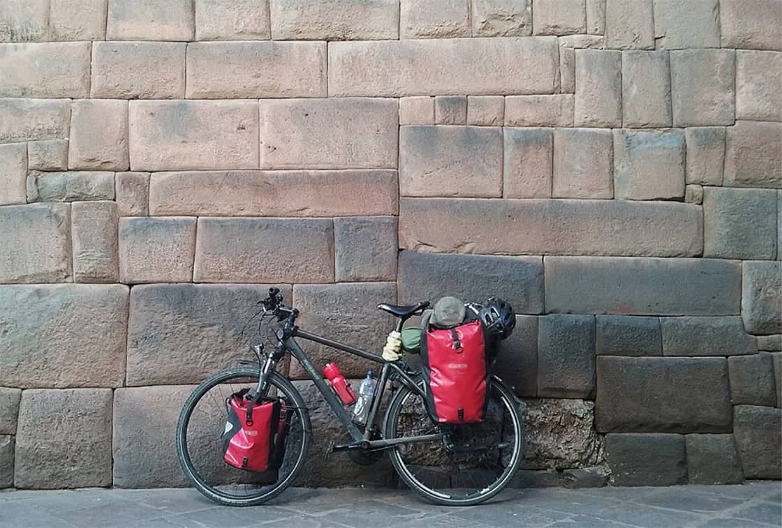 Inca Jungle Trek to Machu Picchu: Biking, Rafting & Hiking (4 Days) - View 2 | Daspe Travel Biking gear preparation at Abra Malaga pass overlooking the high jungle valley