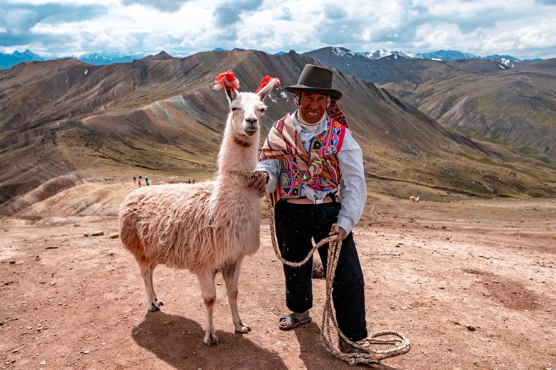 Palcoyo Rainbow Mountain (Gentle & Crowd-Free) - View 1 | Daspe Travel Wide panorama of the three striped mineral ridges at Palcoyo without the crowds of Vinicunca